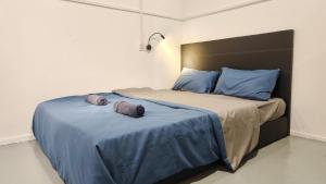 Letto o letti in una camera di Warisan Homestay 18pax Kota Kinabalu