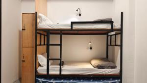 Letto o letti in una camera di Warisan Homestay 18pax Kota Kinabalu