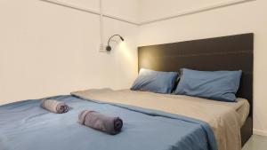 Letto o letti in una camera di Warisan Homestay 18pax Kota Kinabalu