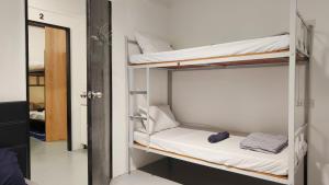 Letto o letti in una camera di Warisan Homestay 18pax Kota Kinabalu