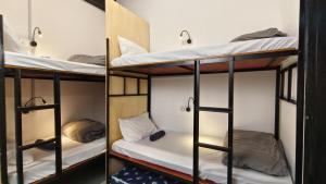 Letto o letti in una camera di Warisan Homestay 18pax Kota Kinabalu