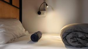 Letto o letti in una camera di Warisan Homestay 18pax Kota Kinabalu