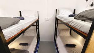 Letto o letti in una camera di Warisan Homestay 18pax Kota Kinabalu