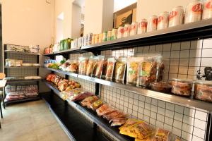 a grocery store aisle with shelves filled with food at MOTOGO Hostel in Sóc Sơn