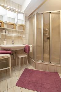 a bathroom with a sink and a shower at Appartementhaus Radstadt in Radstadt