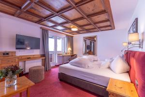 Postel nebo postele na pokoji v ubytování Hotel Sonnenheim