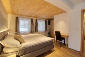 Letto o letti in una camera di Matterhorngruss Apartments