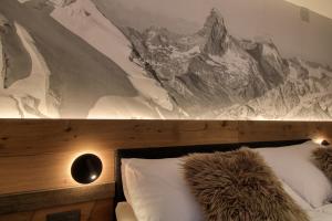 Letto o letti in una camera di Matterhorngruss Apartments
