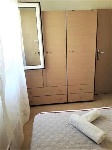 a room with a bed and a window and a door at Elia - seaside place in Agios Nikolaos