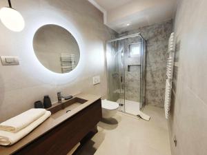 a bathroom with a toilet and a sink and a shower at NEW Ana Design City Center Apartments in Pula