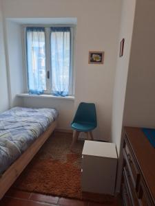 Un pat sau paturi într-o cameră la Casa Vacanze Tavernella di Pam