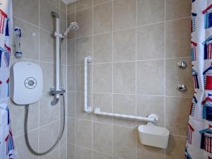 a bathroom with a shower with a shower curtain at 2 Bed in Walcott 81322 in Walcott