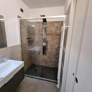 a bathroom with a shower with a glass door at BeB La Terrazza Sui Fieschi in Cogorno