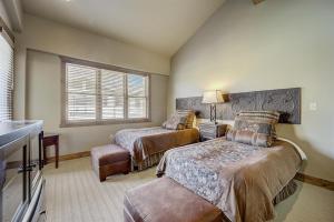 a bedroom with two beds and a window at Mont Cervin 33 by AvantStay Luxury Ski in Ski out home in Park City in Park City