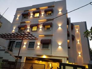 a building with lights on the side of it at New Gokul Grand in Dehradun