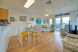 a kitchen and living room with a table and chairs at Salt Sun by AvantStay Beach Access Pool in Port Aransas