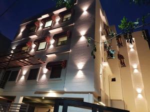 a building with lights on the side of it at New Gokul Grand in Dehradun +11 photos