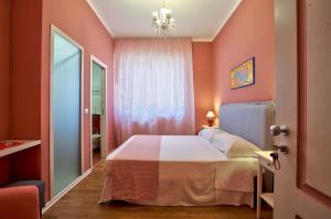 A bed or beds in a room at B&B Del Corso