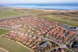 an aerial view of a city with houses and the ocean at Gosewehr GbR in Hooksiel