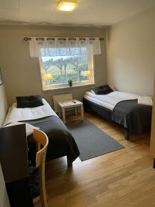 Katil atau katil-katil dalam bilik di Hotell Briggen i Åhus