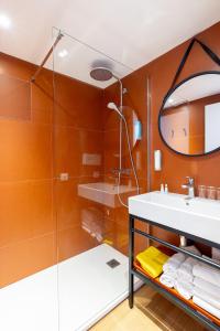 a bathroom with a sink and a mirror at Kaliopé Résidences in Le Lavandou