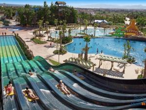 a water park with a water slide at a theme park at APARTBEACH EL CARRILET CENTRICO y LUMINOSO in Reus