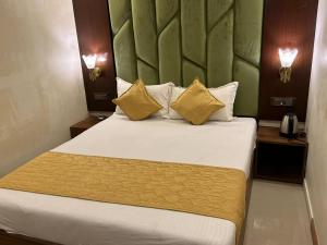 Ένα ή περισσότερα κρεβάτια σε δωμάτιο στο Hotel Air Stay Inn - Andheri East