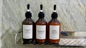 three bottles of wine sitting on a shelf at Namal Apartelle - Free Scooter & GYM access in El Nido +34 photos
