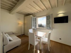 TV a/nebo společenská místnost v ubytování La Chiusa di Rio