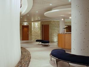 a lobby with two chairs and a waiting room at Sofitel Biarritz Le Miramar Thalassa in Biarritz