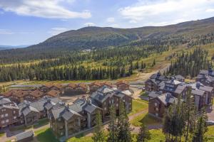 an aerial view of a resort with mountains in the background at Høyfjellsgrend 962 in Trysil