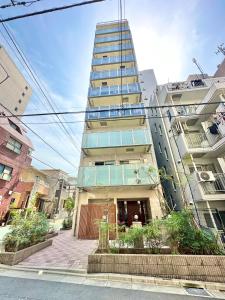 a tall building in the middle of a city at Otsuka No3 Mansion#JR Yamanote Line Otsuka in Tokyo