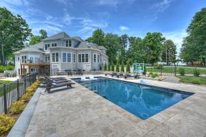 a house with a swimming pool in front of a house at Bright Water Cove by AvantStay Saltwater Pool in Denver
