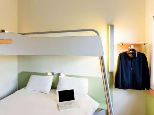 Posteľ alebo postele v izbe v ubytovaní Ibis budget Wien Messe