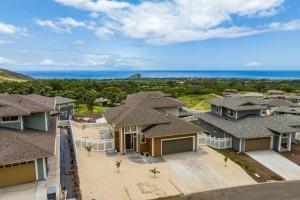 an aerial view of a house with the ocean in the background at Lealea by AvantStay Ocean Mountain Views in Waianae