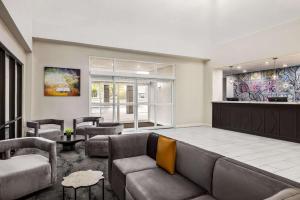 a living room with a couch and chairs at La Quinta by Wyndham Mt. Laurel - Philadelphia in Mount Laurel