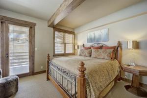 a bedroom with a large bed and a window at Mont Cervin 21 by AvantStay Luxury Ski in Ski out home in Park City in Park City