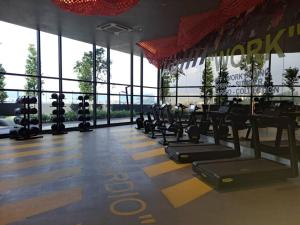 a gym with rows of chairs and a large window at Arte cheras luxury family house link MRT in Kuala Lumpur