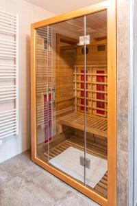 a shower with a glass door in a bathroom at Haus Sonnengarten-Lienz in Lienz