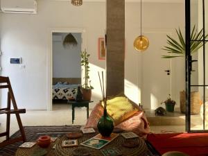 a living room with a table and a couch at Cosy home in Sidi Bou Said in Sidi Bou Saïd