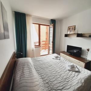 Postel nebo postele na pokoji v ubytování Апартамент В204 Belvedere Holiday Club