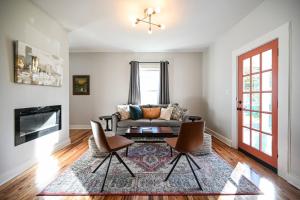 a living room with a couch and two chairs at Sweet Carolina by AvantStay Near Black Mountain in Swannanoa