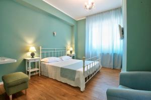 A bed or beds in a room at B&B Del Corso