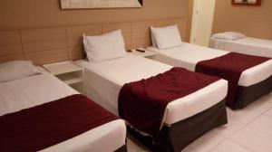 Postel nebo postele na pokoji v ubytování Grande Hotel Itaguaí