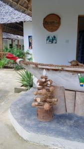 a pile of mushrooms sitting on top of a barrel at Polly Lodge Bungalow Zanzibar Kiwengwa in Kiwengwa