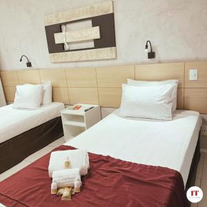 Postel nebo postele na pokoji v ubytování Grande Hotel Itaguaí