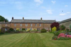 a large brick house with a large yard at 2 Bed in Eden Valley SZ483 