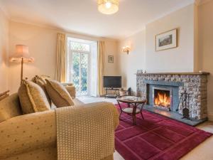 a living room with a couch and a fireplace at 3 bed property in Pardshaw Lake District SZ419 in Dean
