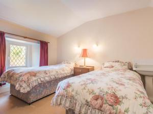 a bedroom with two beds and a window at 3 bed property in Pardshaw Lake District SZ419 in Dean