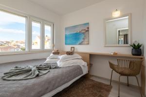 Postel nebo postele na pokoji v ubytování Apartments Holidays Roko